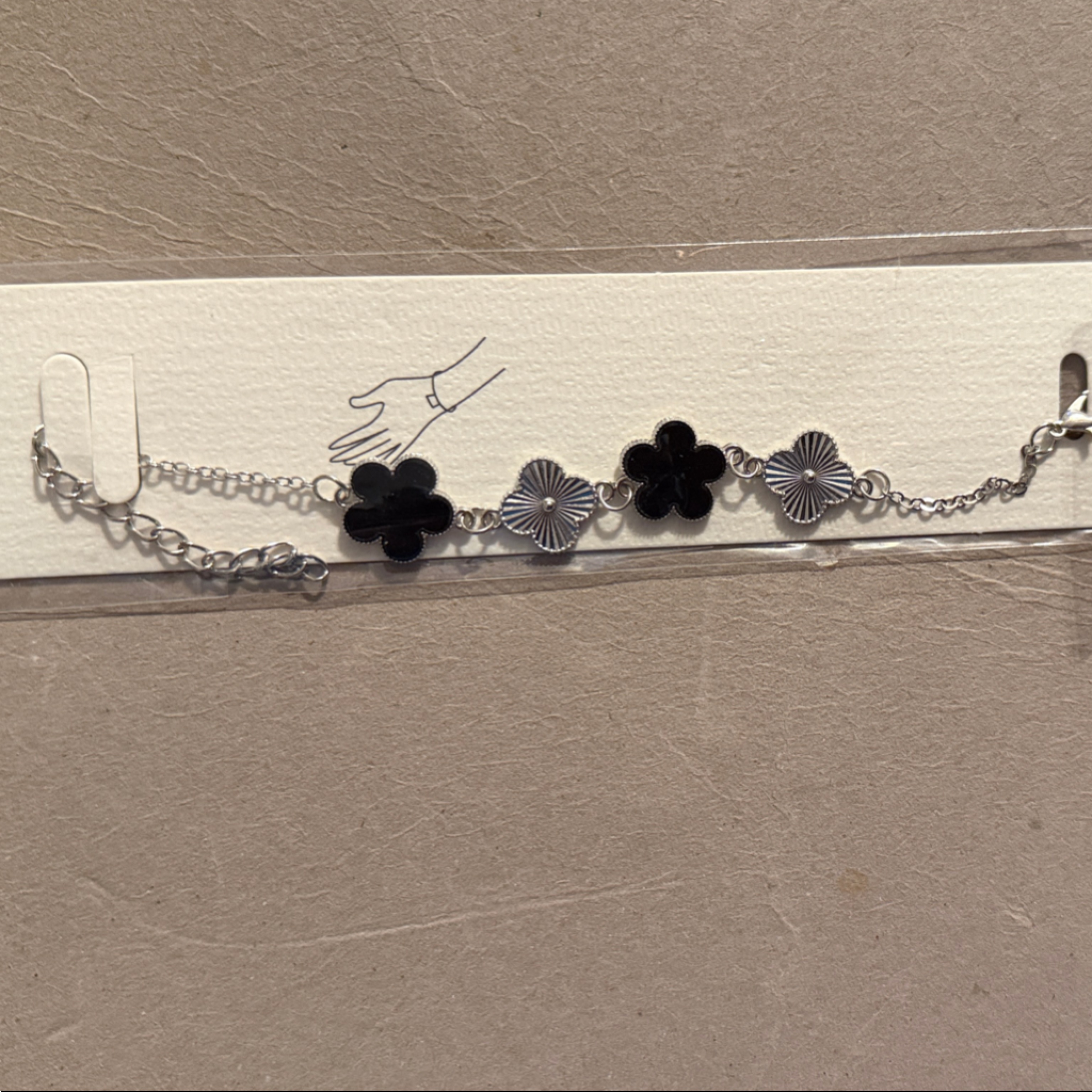 Silver Link Bracelet With Black Clover Accents
